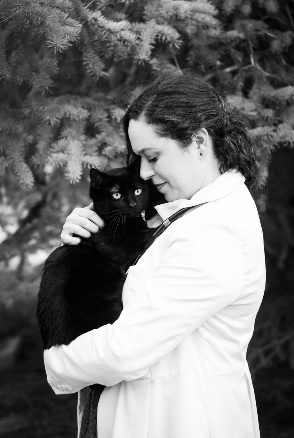 Day Fay holding a black cat